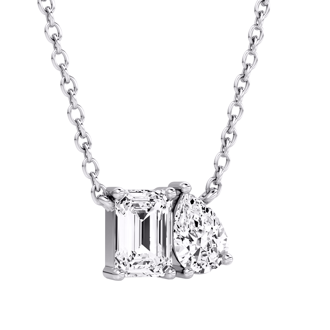 Toi et Moi diamond pendant in white gold with emerald and pear cut
