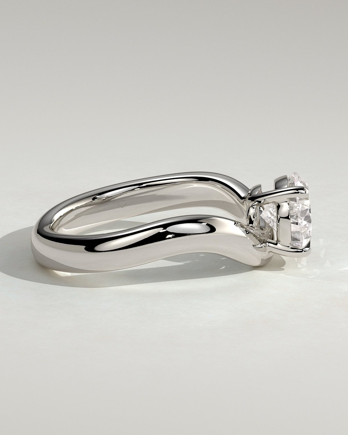 Pear Solitaire Bypass Engagement Ring in Gold