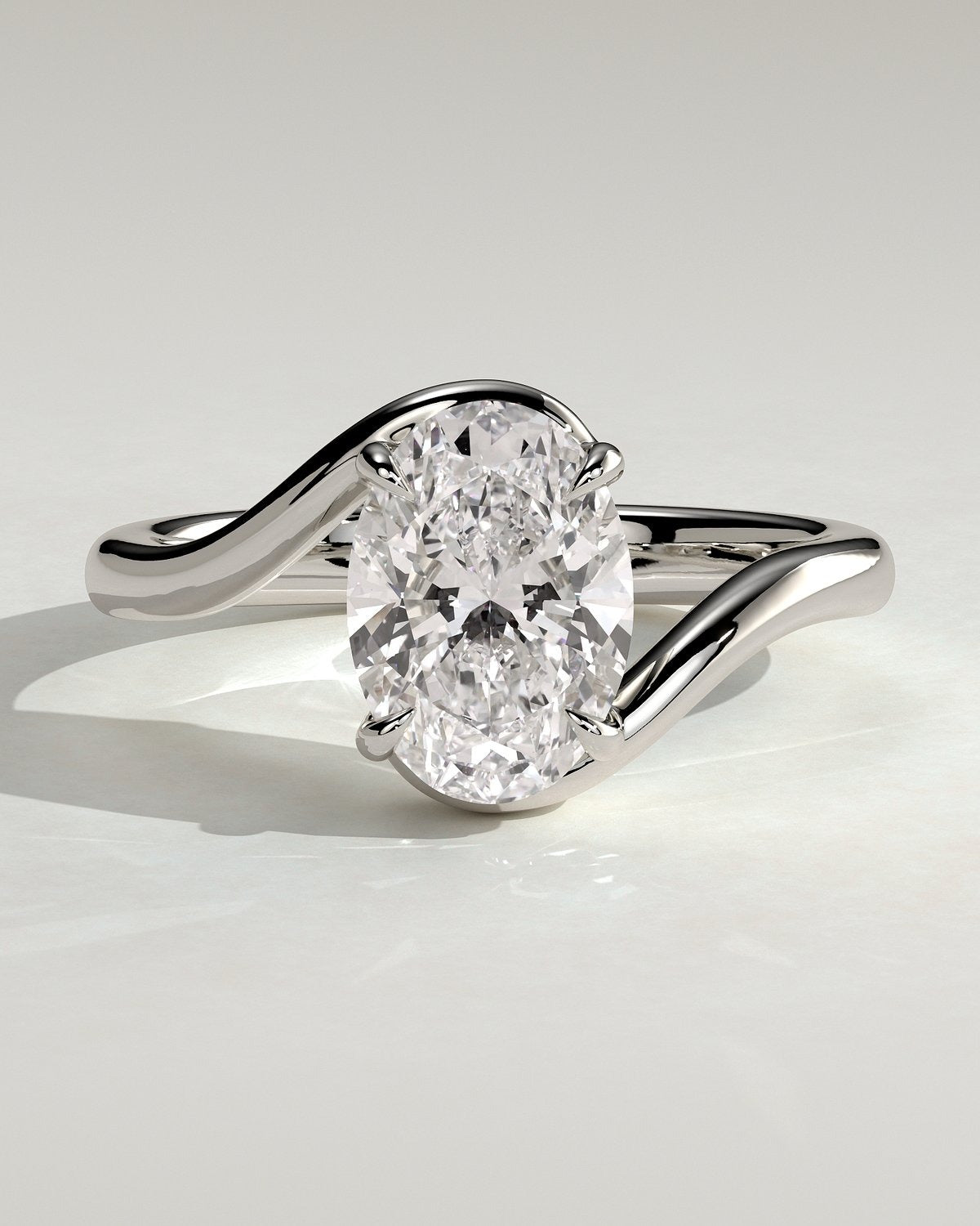 Oval Solitaire Bypass Engagement Ring in Gold