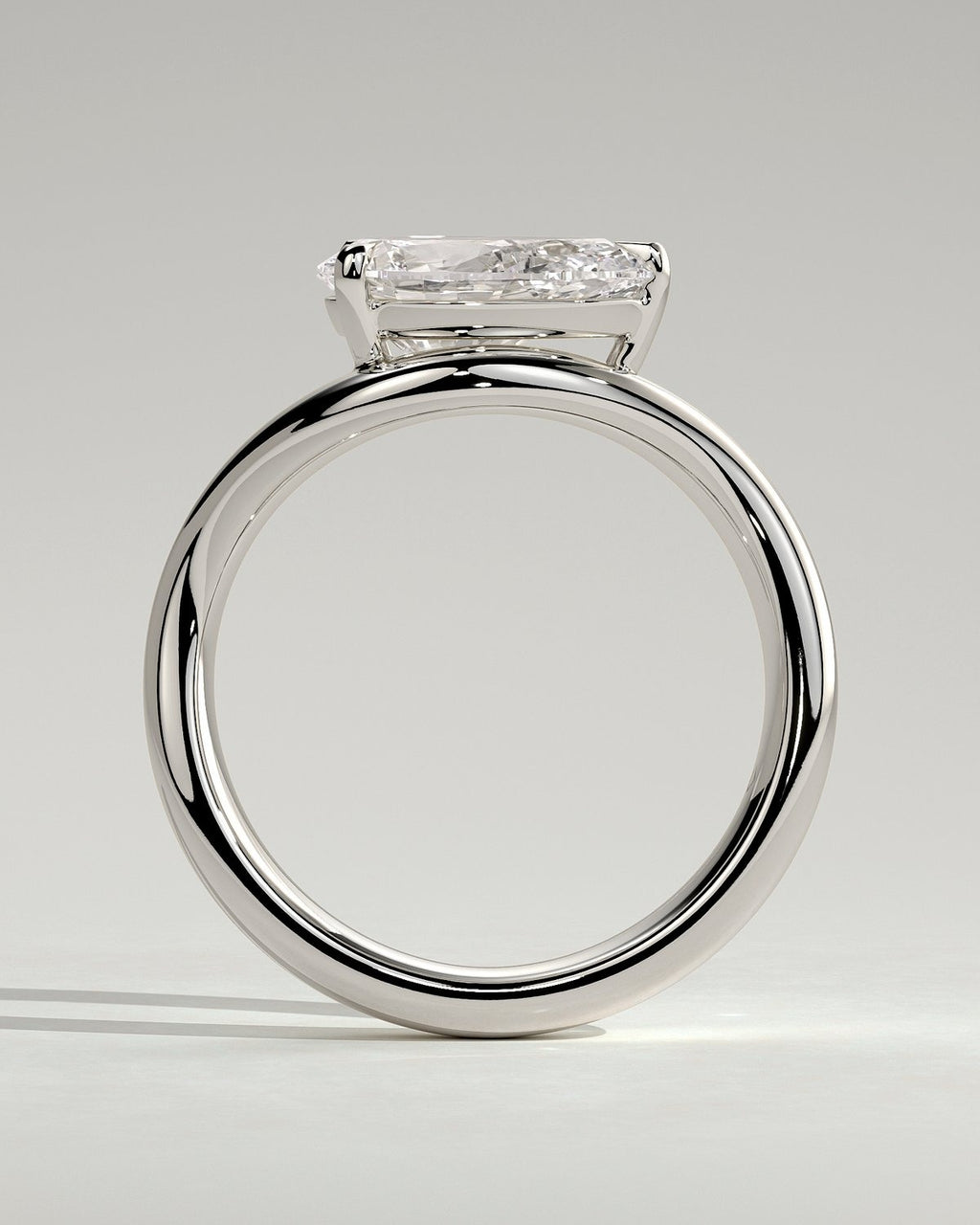 Pear Solitaire Bypass Engagement Ring in Gold