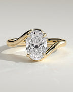 Oval Solitaire Bypass Engagement Ring in Gold