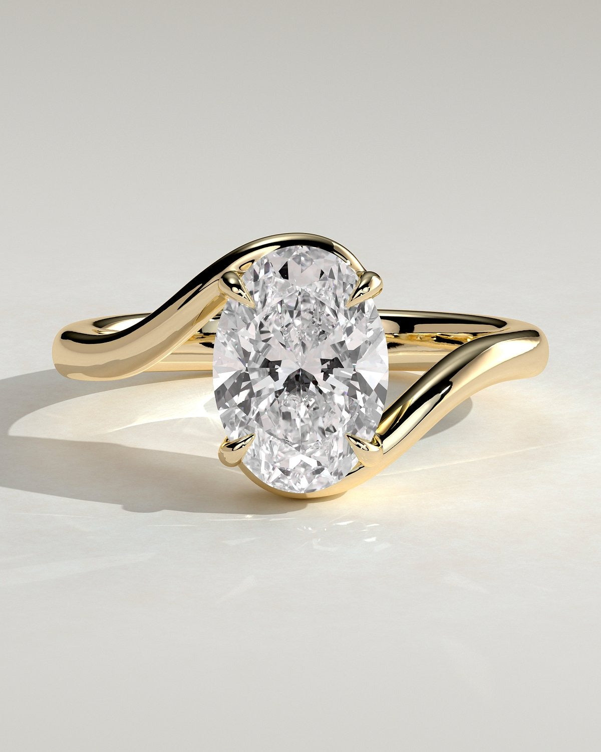 Oval Solitaire Bypass Engagement Ring in Gold