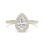 A pear-cut diamond engagement ring in yellow gold with a halo and pavé band, centered on a clean white background.