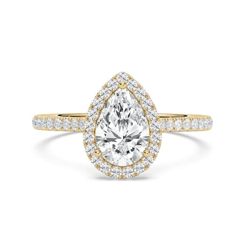 A pear-cut diamond engagement ring in yellow gold with a halo and pavé band, centered on a clean white background.