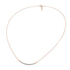 Rose gold necklace on a white background