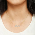 Woman wearing infinity symbol diamond pendant