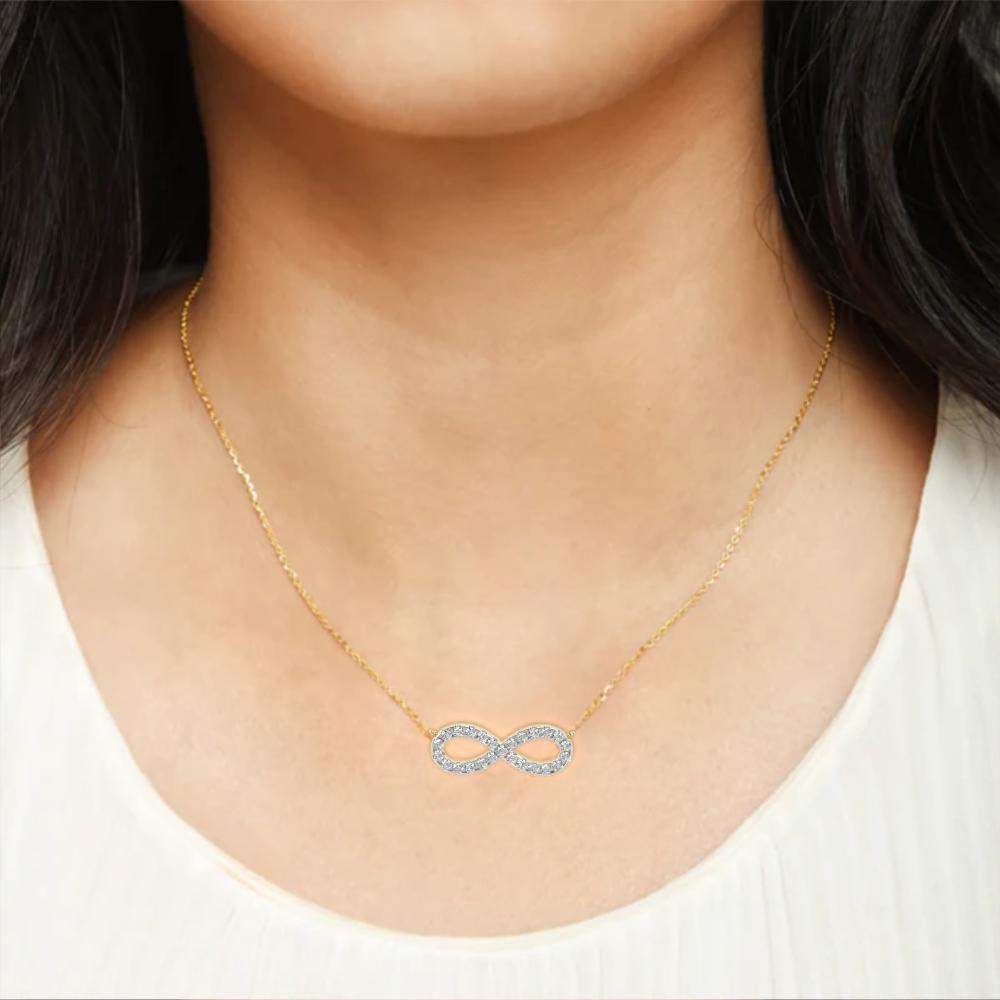 Woman wearing infinity symbol diamond pendant