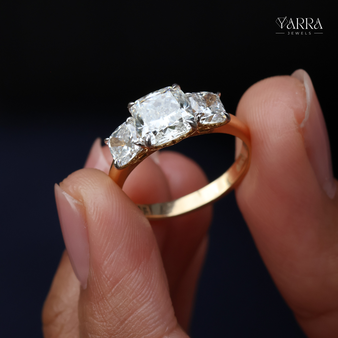 Cushion Cut Three-Stone Diamond Ring in Gold