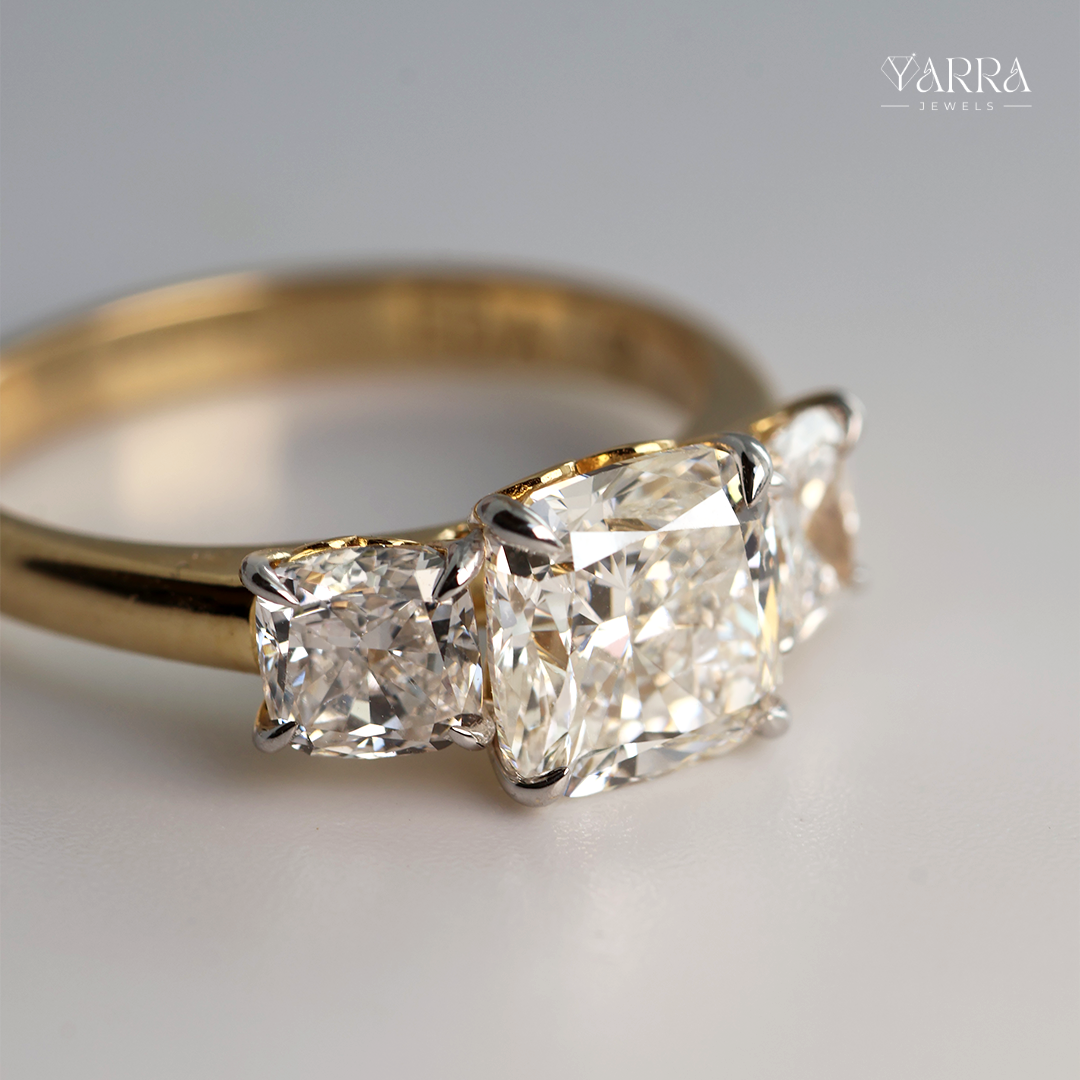 Cushion Cut Three-Stone Diamond Ring in Gold