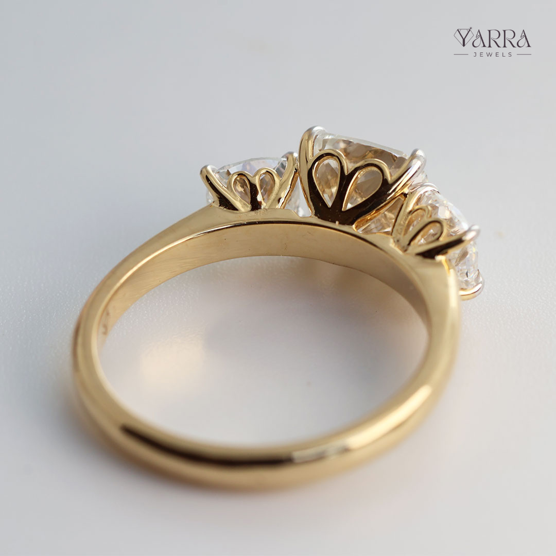 Cushion Cut Three-Stone Diamond Ring in Gold
