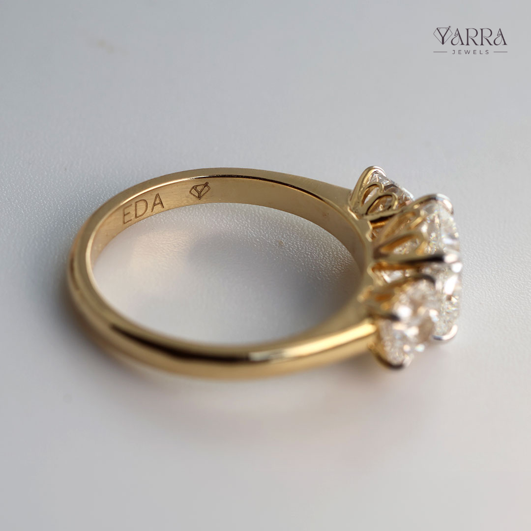Cushion Cut Three-Stone Diamond Ring in Gold