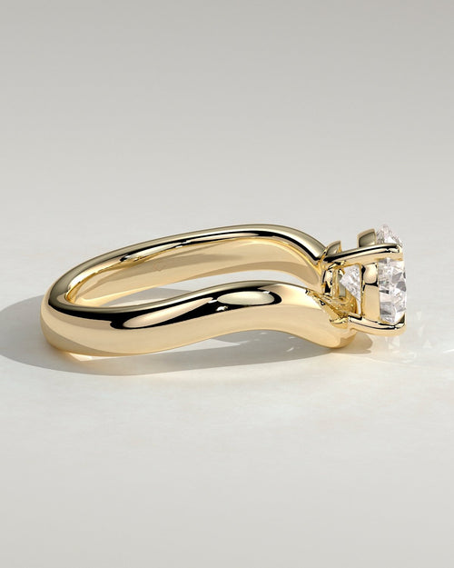 Pear Solitaire Bypass Engagement Ring in Gold