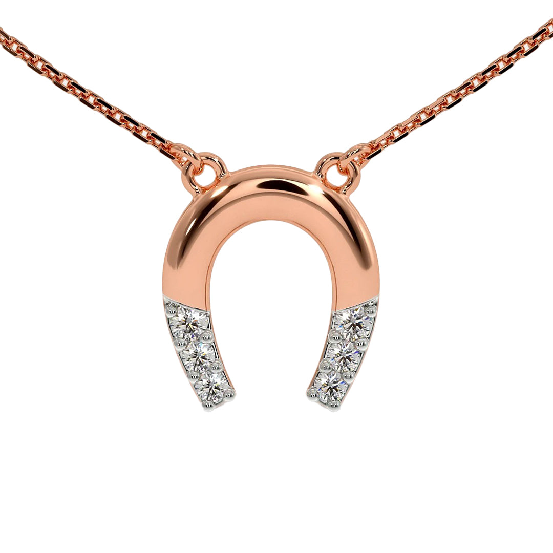 Rose gold horseshoe pendant with diamonds on a white background