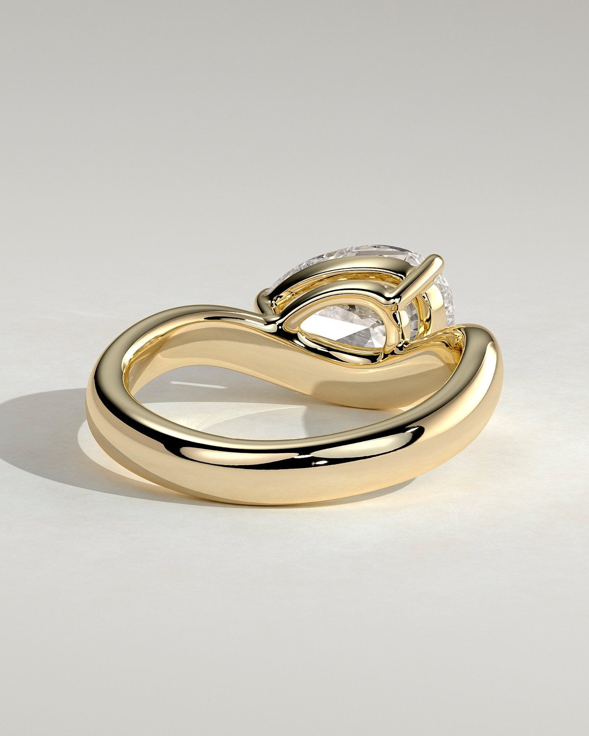 Pear Solitaire Bypass Engagement Ring in Gold