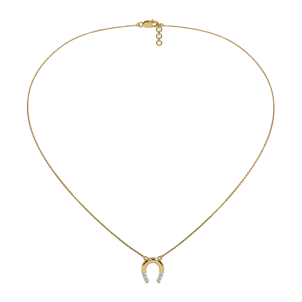 Gold necklace with a horseshoe pendant on a white background