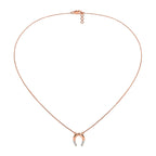 Rose gold necklace with a small pendant on a white background