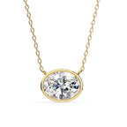 Oval-shaped diamond pendant in gold