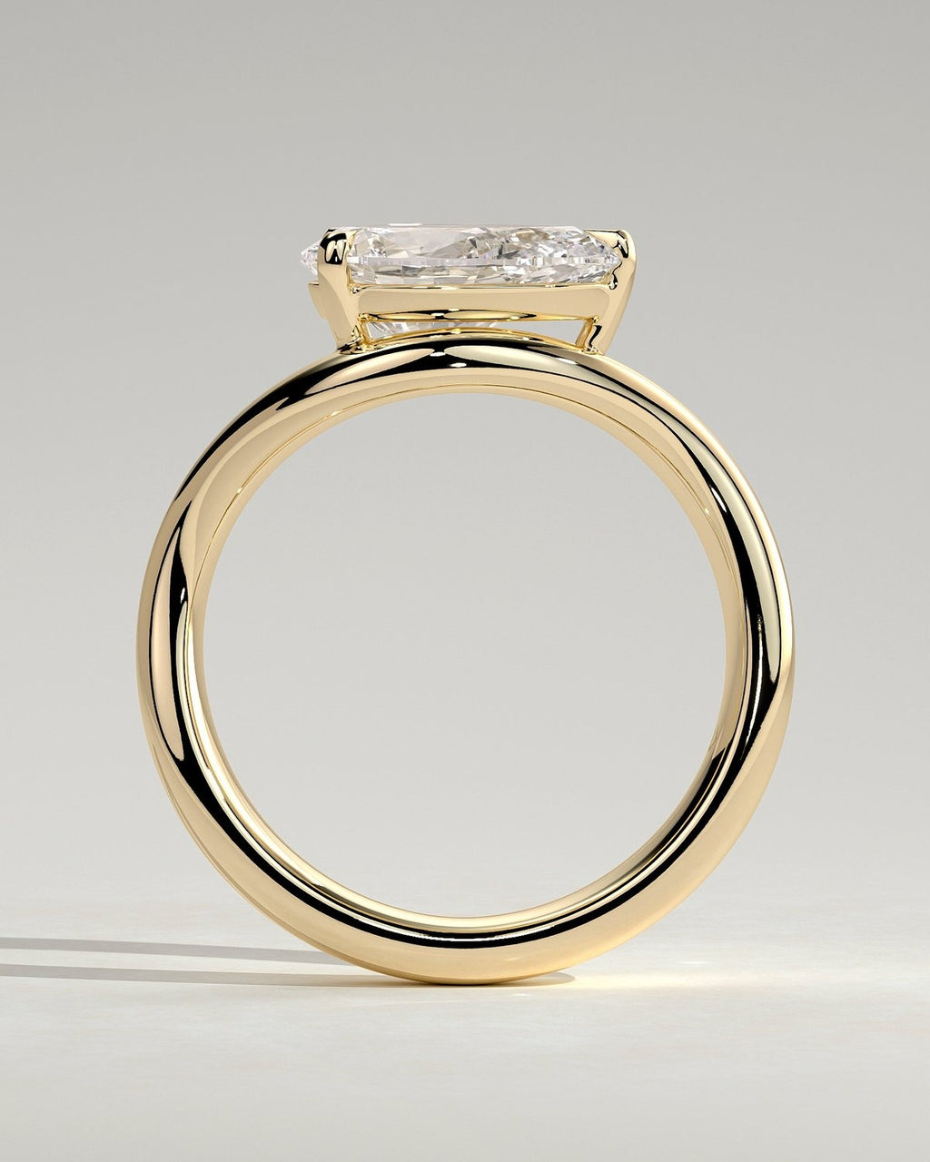 Pear Solitaire Bypass Engagement Ring in Gold