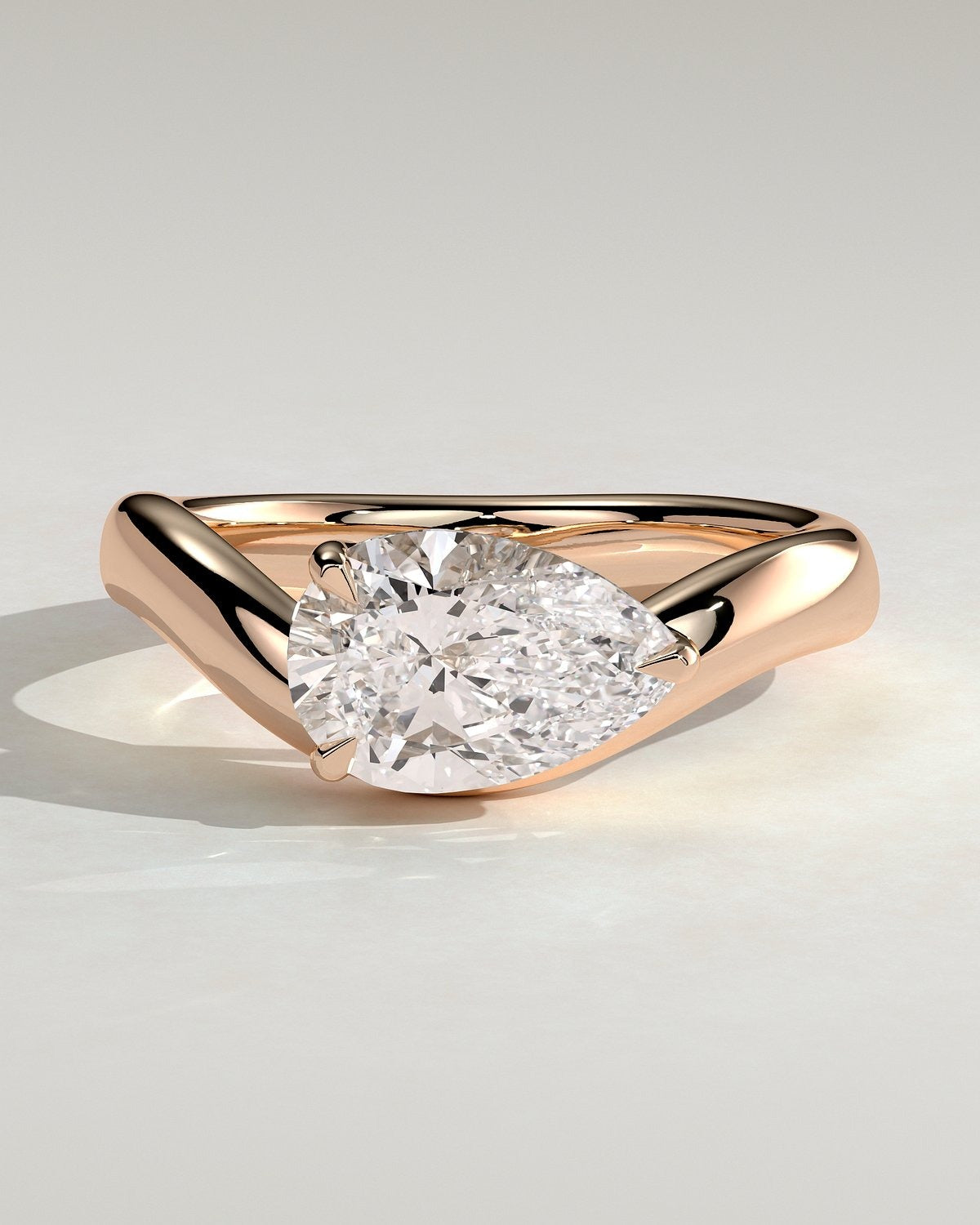 Pear Solitaire Bypass Engagement Ring in Gold
