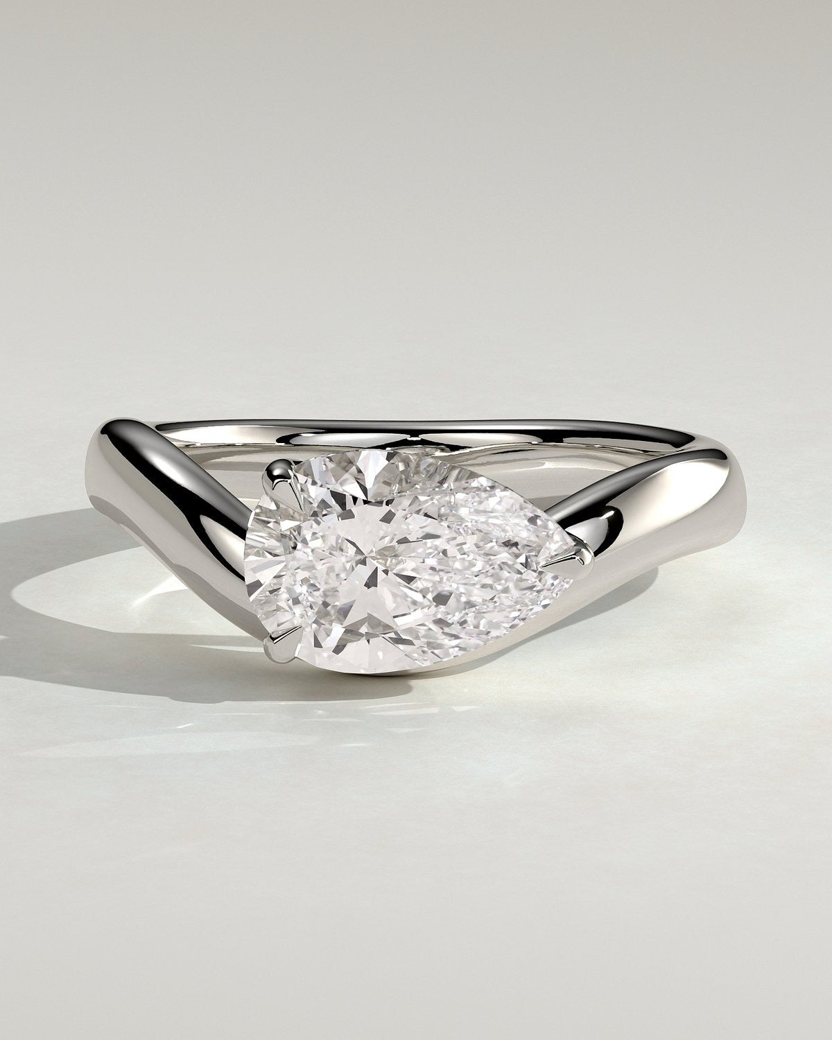 Pear Solitaire Bypass Engagement Ring in Gold