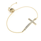 Diamond cross bracelet in gold