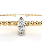 Rope-pattern gold bracelet with marquise-cut diamond