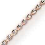 Rose Gold bangle with teardrop-shape round diamonds