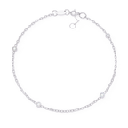 Dainty adjustable white gold diamond bracelet with bezel-set stones