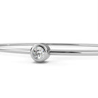 Minimal white gold bangle with round diamond