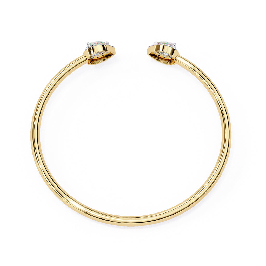Gold cuff bracelet with pear-cut diamonds