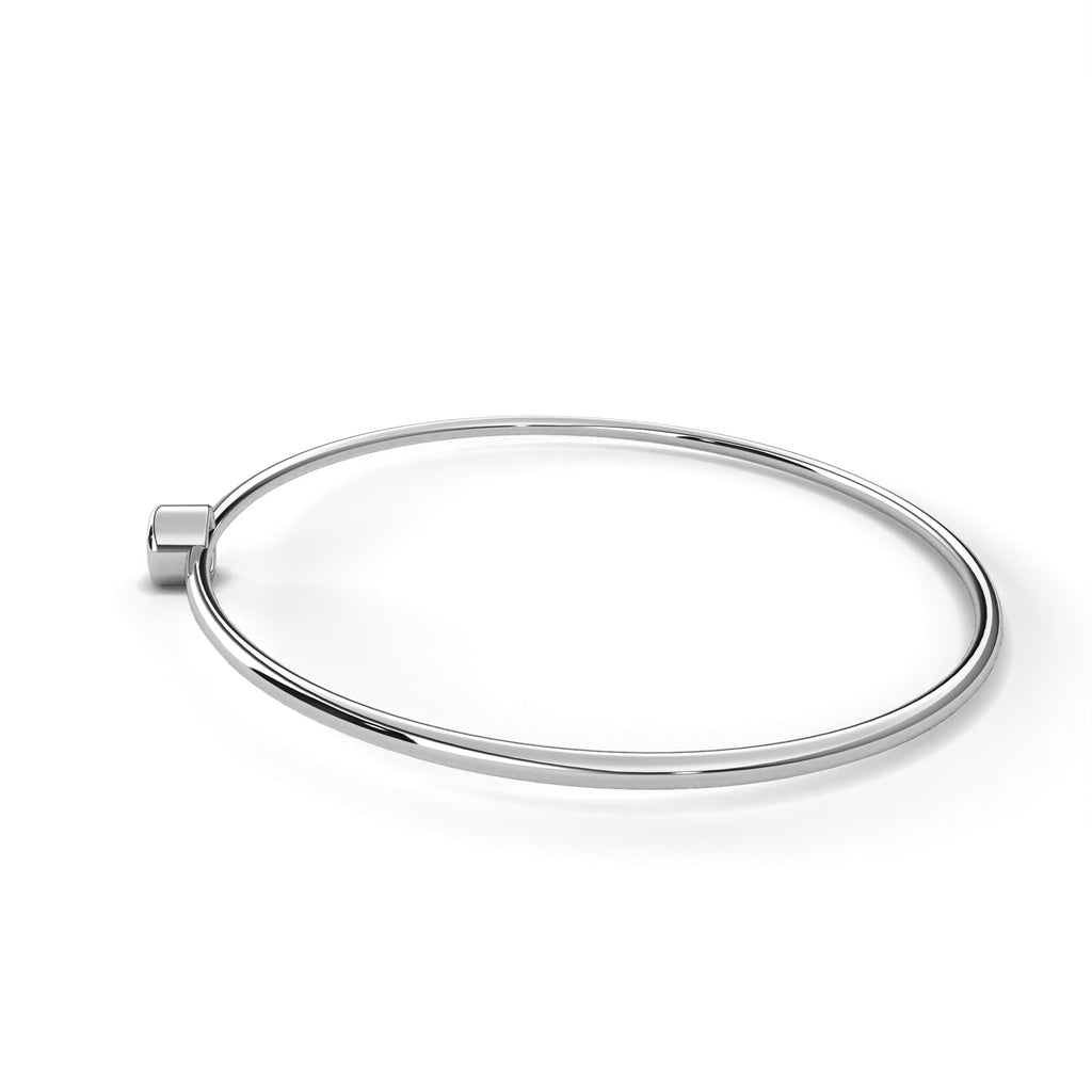 Delicate white gold bangle with diamond