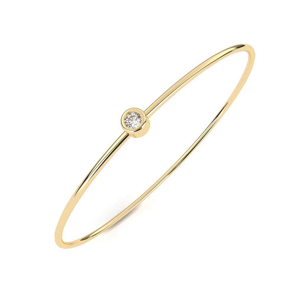Delicate gold bangle with diamond