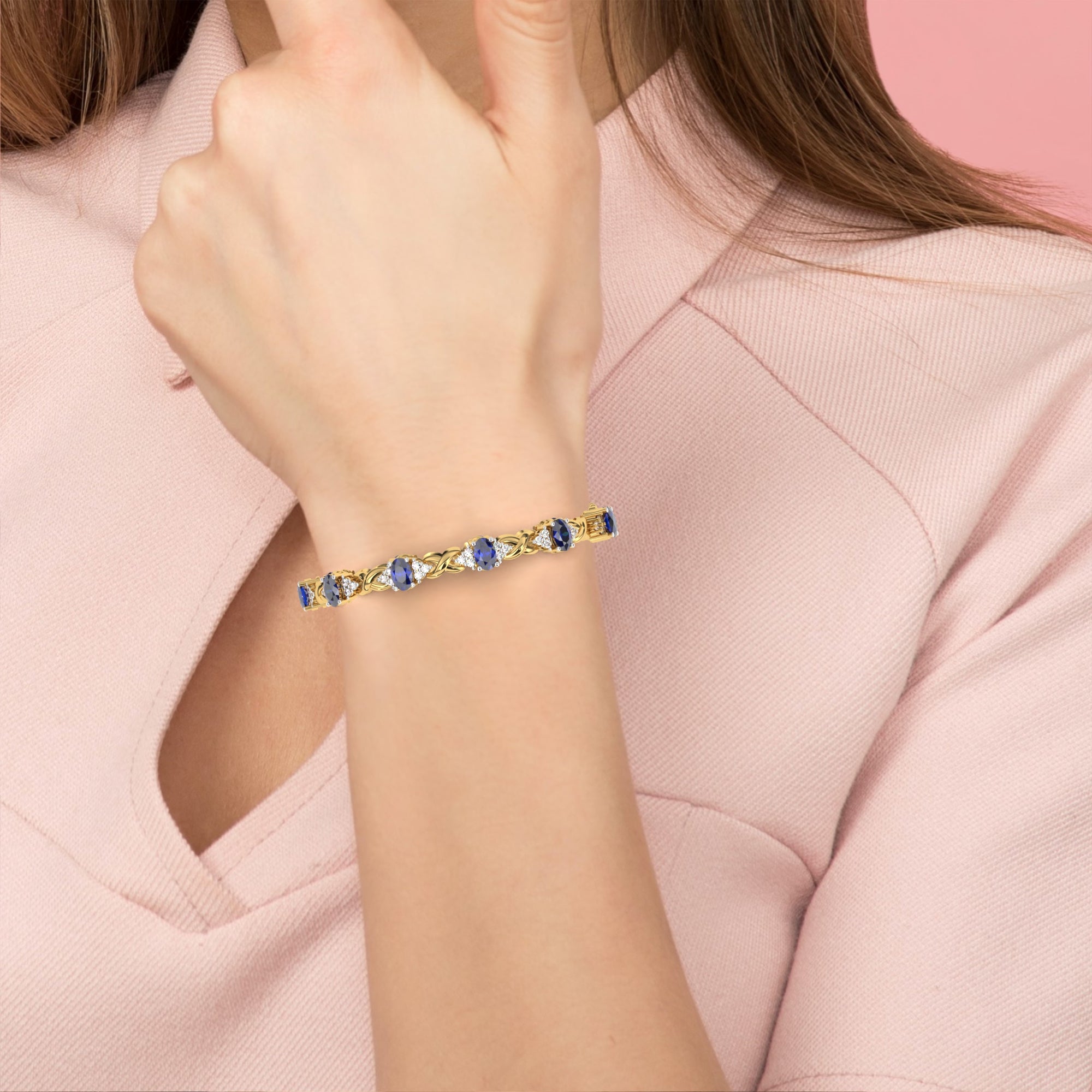 Woman wearing blue sapphire stone and diamond bracelet