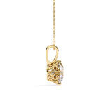 Side view of gold diamond pendant with vintage filigree pattern