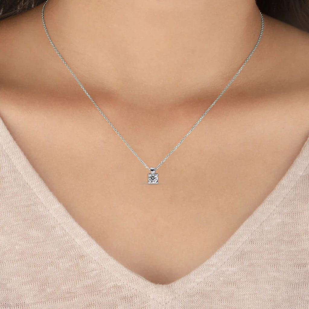 Woman wearing Classic solitaire round diamond necklace