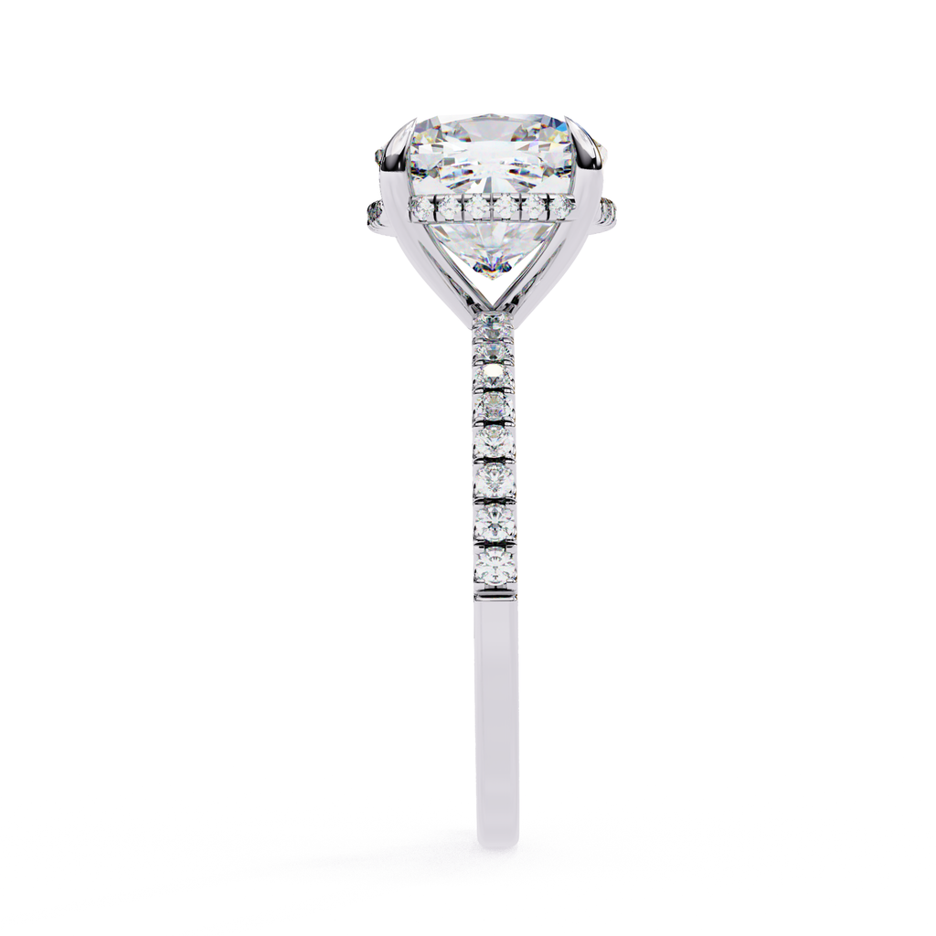 Cushion cut solitaire diamond ring with pavé shoulders