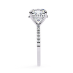 Cushion cut solitaire diamond ring with pavé shoulders