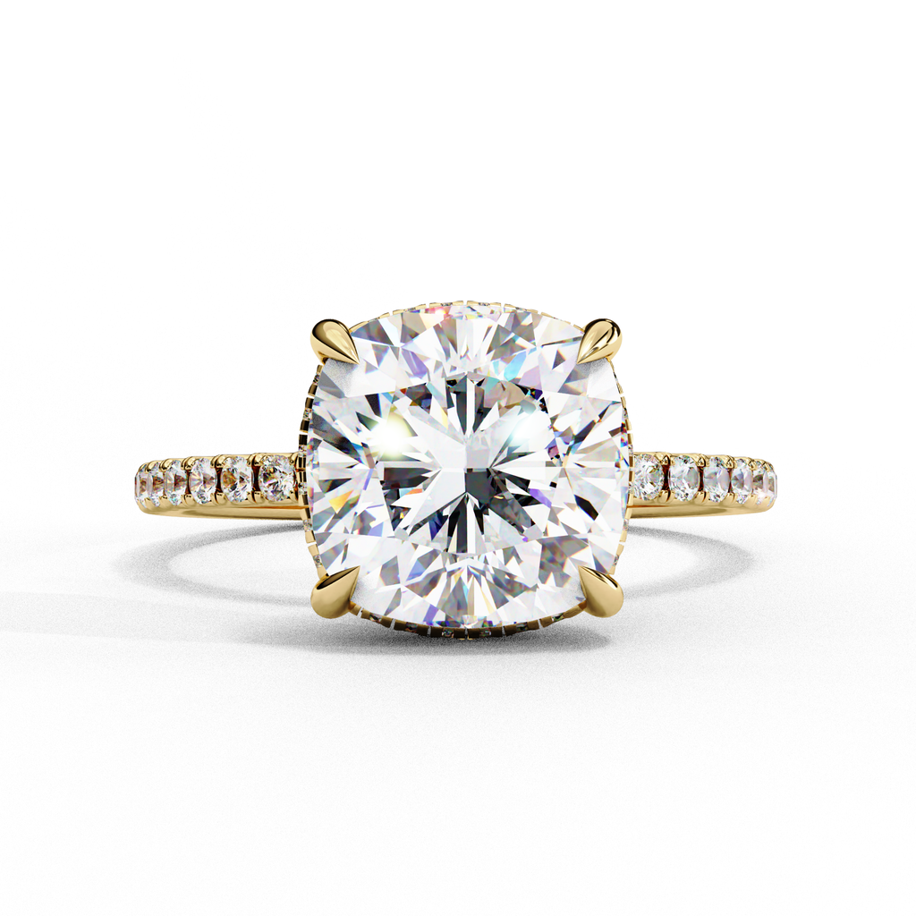 Cushion cut diamond engagement ring with pavé band in gold