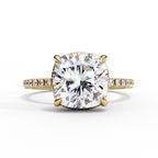 Cushion cut diamond engagement ring with pavé band in gold