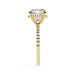 Cushion cut solitaire diamond ring with pavé shoulders