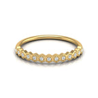Dainty gold wedding ring with sparkling round diamonds