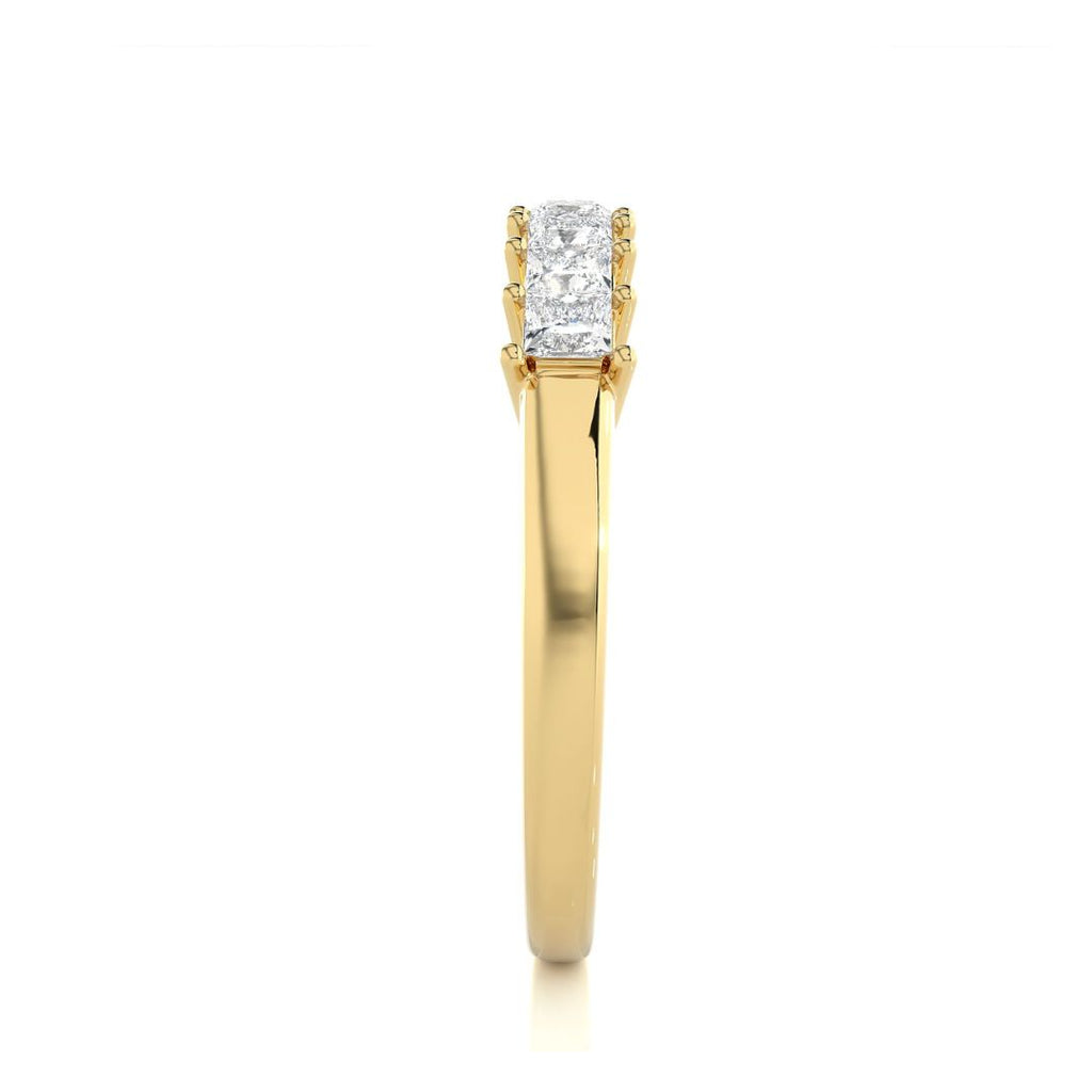 Gold wedding ring with diamonds on a white background