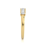 Gold wedding ring with diamonds on a white background