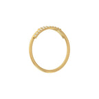 Gold wedding ring with small diamonds on a white background