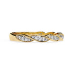 Gold wedding band with diamond accents on a white background