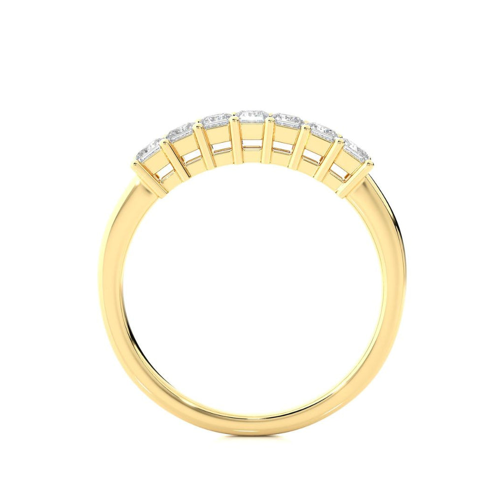 Gold wedding band for woman on a white background