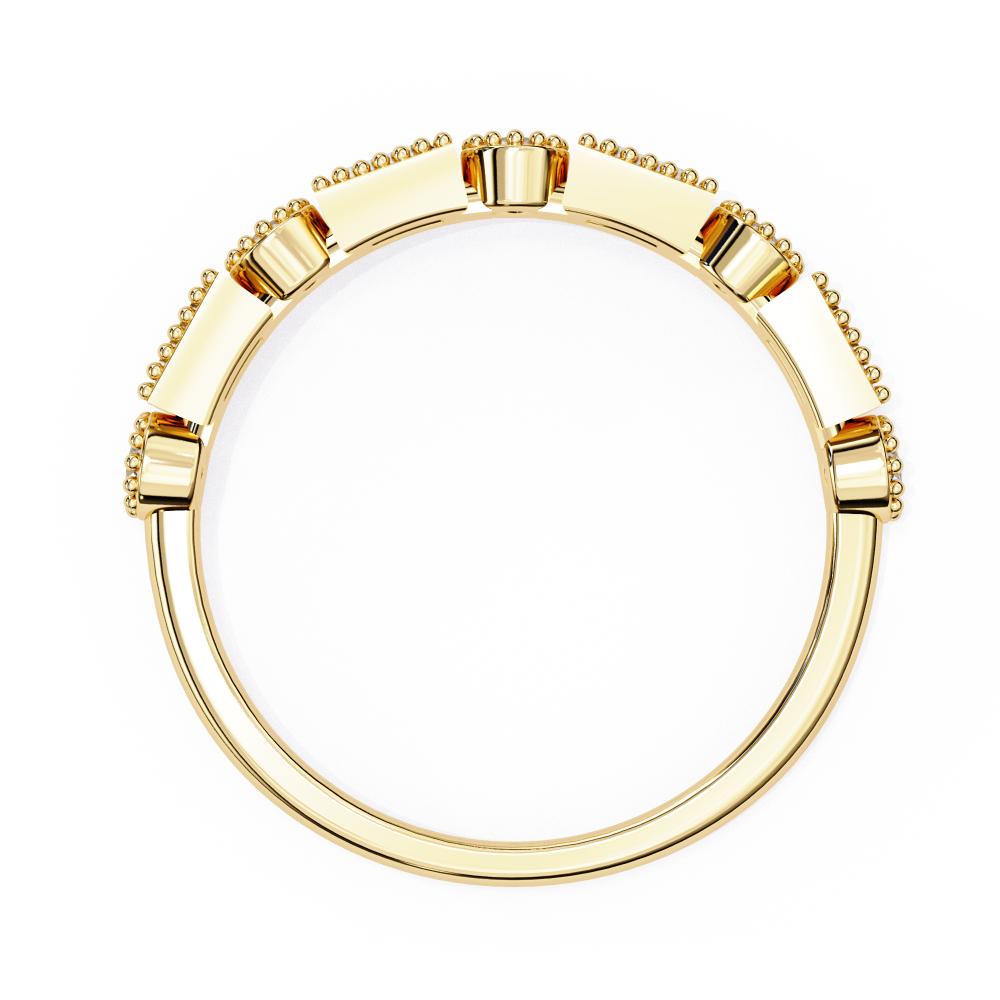 Gold wedding band on a white background