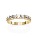 Gold wedding band with diamond accents on a white background