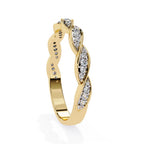 Gold ring with diamond accents on a white background