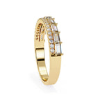 Gold wedding ring with diamond accents on a white background